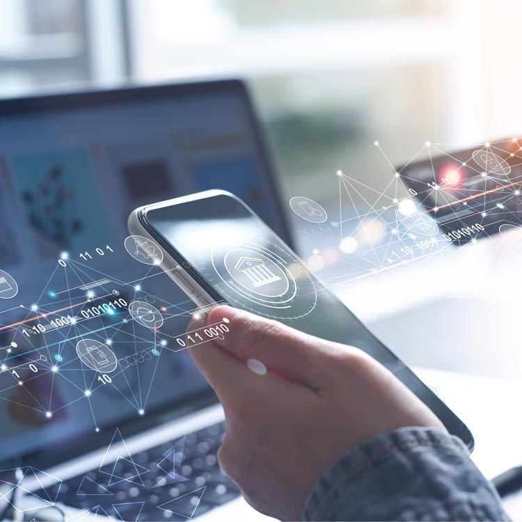 Hand holding a smartphone with fintech data overlays
