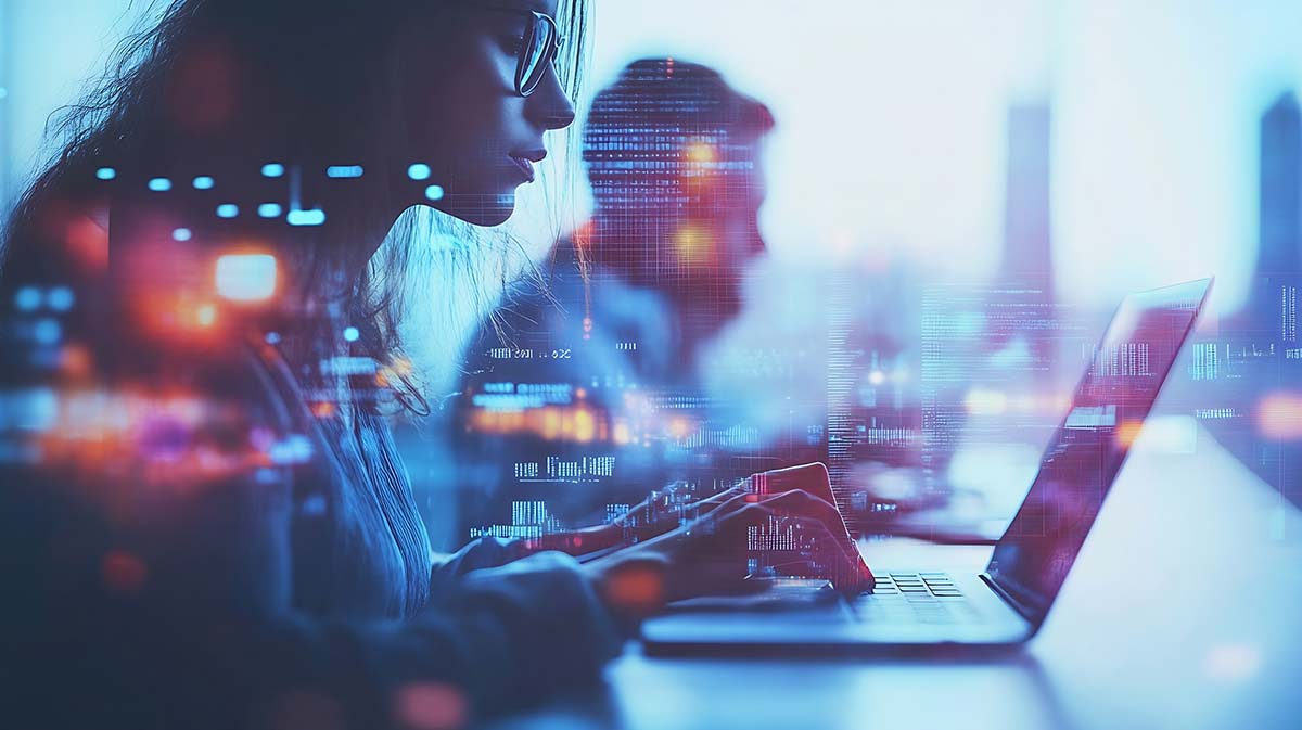 Engineer at a laptop with digital image-processing overlays