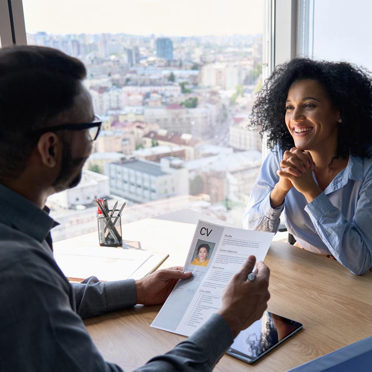 Recruiter reviewing a CV during a job interview